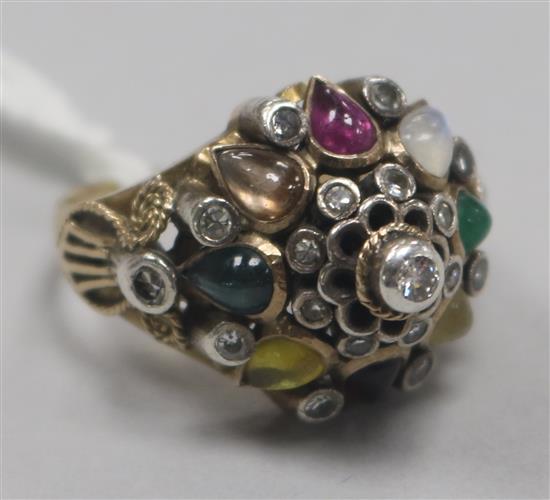 A gold and multi gem set dome topped dress ring, size P.